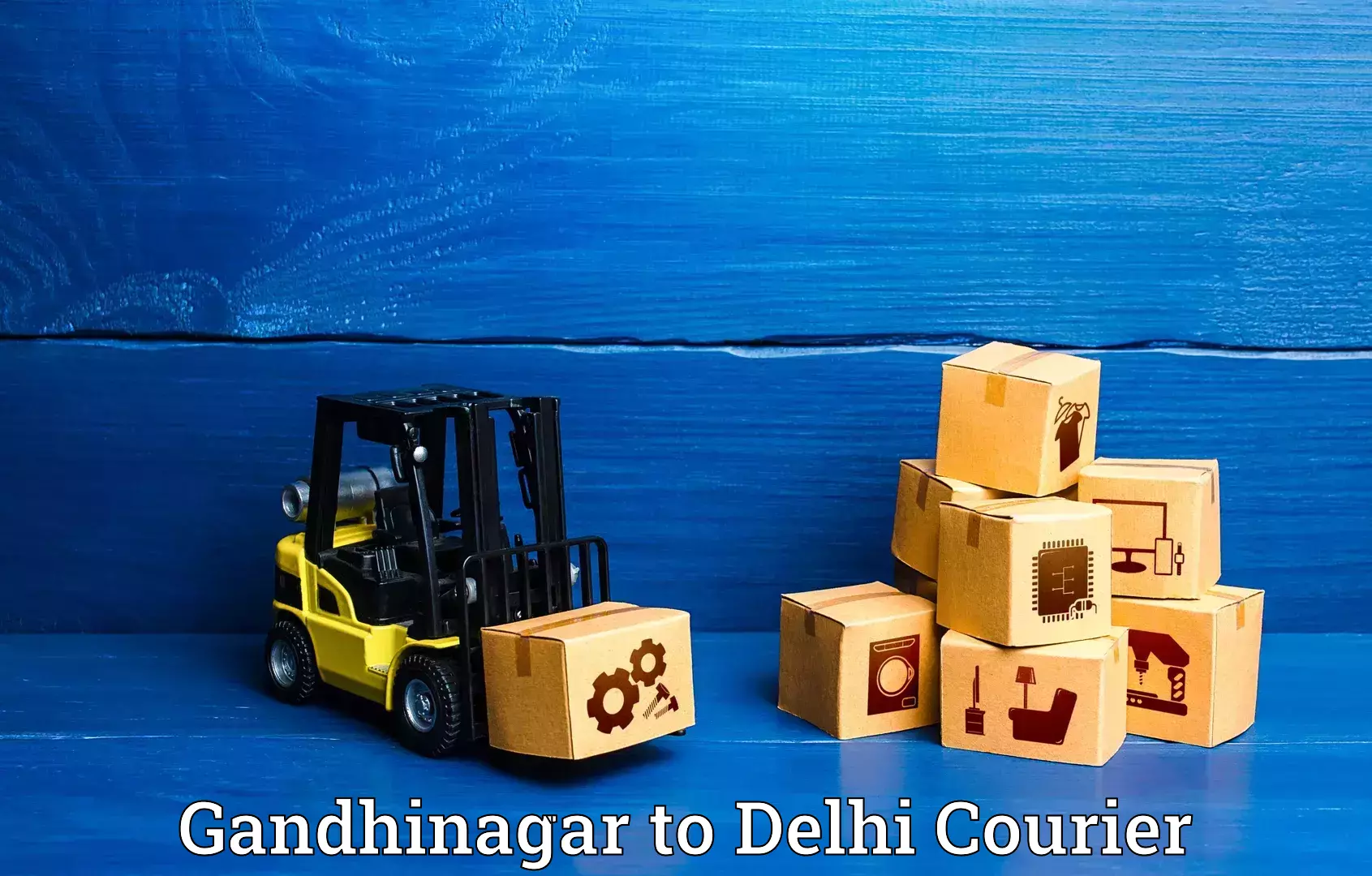 Artwork baggage courier in Gandhinagar to Jamia Hamdard New Delhi